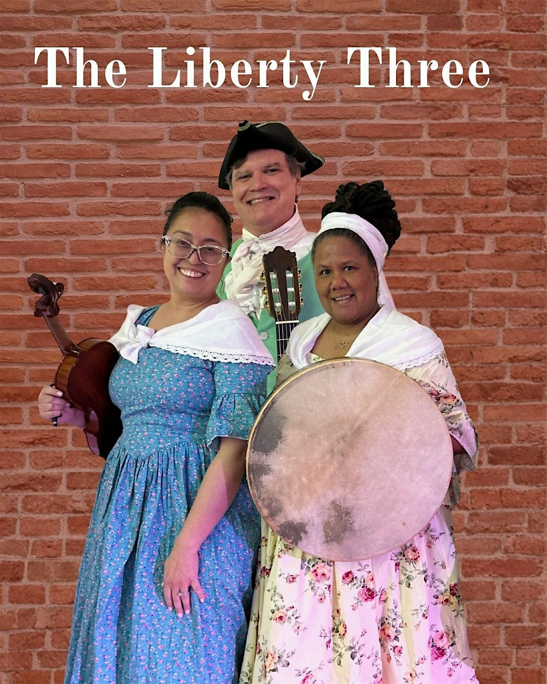 Cover photo of The Liberty Three: three musicians in period costumes with violin, guitar, and large drum against a brick wall.